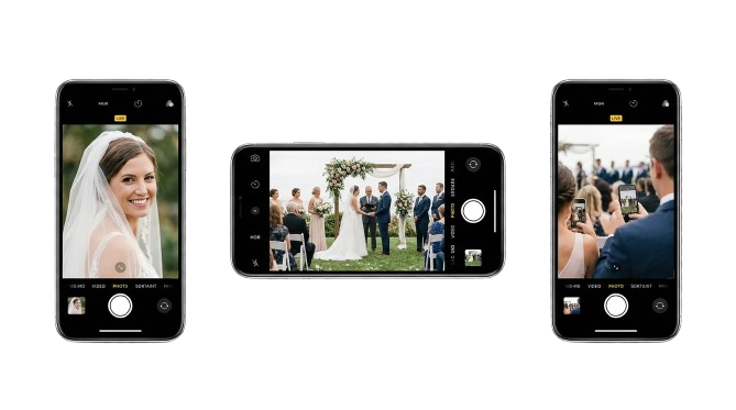Guests capturing wedding moments on phones around the ceremony